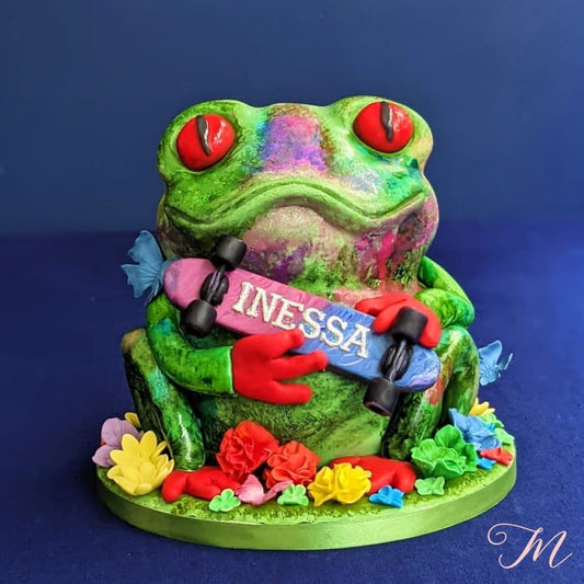 Fun 3d modern frog cake for a kids party centerpiece.