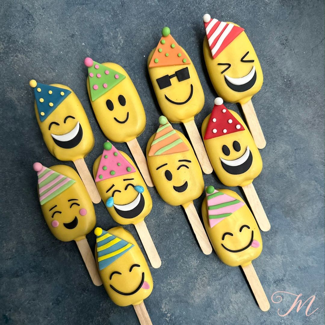 Creative baked Emoji Party Cakesicles for fun and delicious children's parties